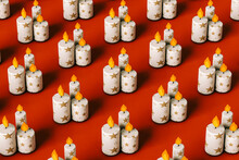 Cartoon Pattern Of Christmas Candles On Red Background