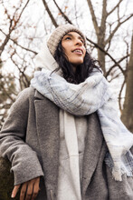 Model Wearing Wool Coat And Beanie Outdoors