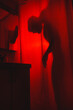 © Ivan Andrianov/Stocksy - Red Horror Abstract Man Silhouette In Shower Room