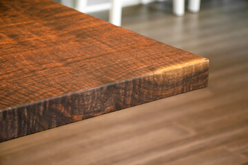 Poster - Close up of walnut solid wooden dining table. Claro Walnut wood table.
