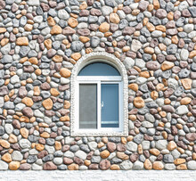 Small Window On Stone Wall