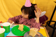Little Girl Eating Birthday Cake 