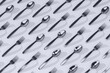 © Marcos Osorio/Stocksy - Spoons and forks background