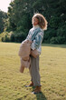 © RZCREATIVE/Stocksy - Young woman standing in the sun.