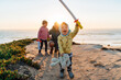 © Gemma can fly/Stocksy - Happy family playing outdoors at sunset