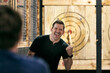 © Sean Locke/Stocksy - Man Excited After Hitting Bullseye With Axe