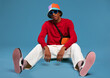 © BONNINSTUDIO/Stocksy - Cool black man sitting in studio