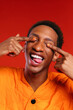 © BONNINSTUDIO/Stocksy - Funny black man showing tongue