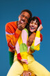 © BONNINSTUDIO/Stocksy - Funny multiracial couple having fun