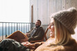 © Studio Firma/Stocksy - Man and Woman Sitting on Terrace