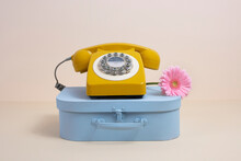 Blue Case And Yellow Phone With Pink Flower