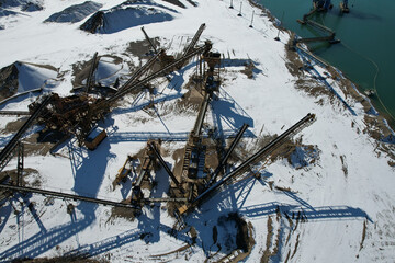 Sticker - An aerial view of a construction site surrounded with water