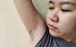 © Rung Kh - portrait a teenage looking armpit hair, facial expressions and worry, concept health care.