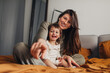© Studio Firma/Stocksy - Mother and Daughter Sitting on Bed
