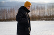 © Olga Kozicka/Stocksy - Man Walking On Sunny Winter Day