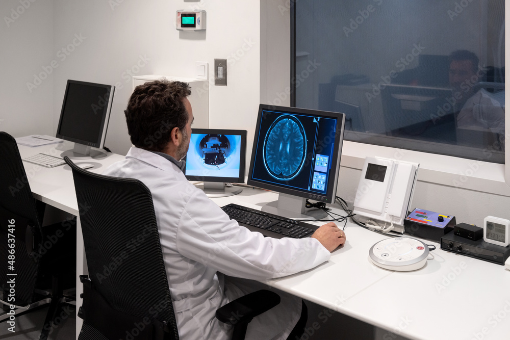 Researcher working on some brain scans at computer in the lab Stock ...