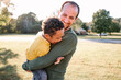 © Erin Drago/Stocksy - Dad and Son, who has Down Syndrome