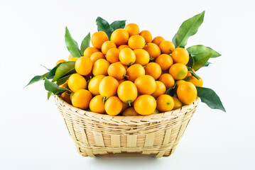 Wall Mural - Bamboo basket full of fresh kumquats