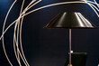 Lamp with black lampshade on black wall background