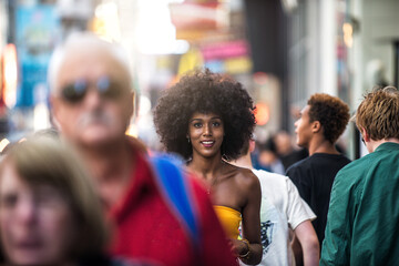 Cinematic portraits of a beautiful american young woman with curly hair in New york. Concept about new yorkers lifestyle and people