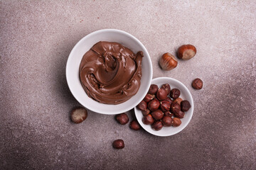 Wall Mural - Tasty chocolate cream or sweet nut butter with whole hazelnuts