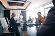 © oneinchpunch - Cinematic image of a multiethnic business team working together in Dubai in offices. Concept about finance, investments and real estate market