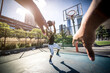 © oneinchpunch - Two basketball players playing hard on the court. Street basketball challenge in New york. Concept about sport and lifestyle