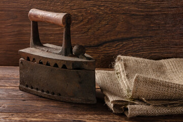 Vintage old iron on a wooden background. Vintage style