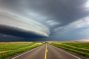 Wall Mural - Road with dark storm clouds