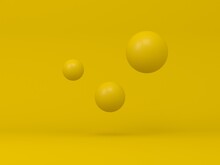 Three Yellow Spheres On Yellow Background