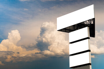 Wall Mural - four blank white billboards against warm sunset sky with clouds - mock up. consumerism, advertising,