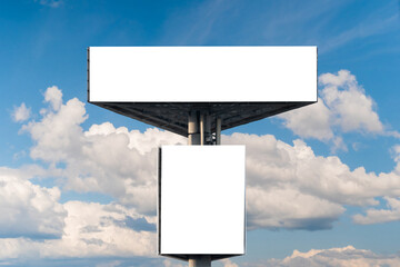 Wall Mural - mock up - two blank white billboards or large advertising displays against blue sky with white cloud