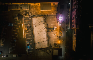 Canvas Print - A top view of a building with people outside