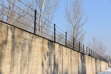 Wall And Barbed Wire Fence Of The Unit 731 Building In Harbin, China. 