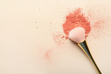 Makeup brush and loose eye shadow on light background