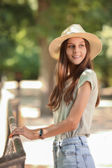 Beautiful young woman in zoological garden