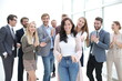 © ASDF - happy woman leader on the background of her business team