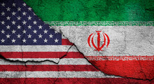Full Frame Photo Of Weathered Flags Of United States (USA, US, America) And Iran Painted On A Cracked Wall. US-Iran Conflict Concept.