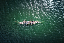 Overhead View Of Dragon Boat Racing Team.