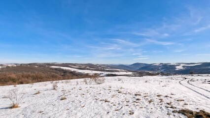 Wall Mural - Winter nature landscape. Beautiful winters sunny day. Snow covered hills and fields.