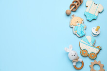 Baby Shower Cookies And Toys On Turquoise Background, Flat Lay. Space For Text