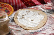 Homemade arabian flatbread (other names is pita, lavash, lafa, parantha, roti, chapati) with zaatar and labneh