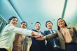 © bank215 - Asian Business working team join hand together for working,selecive focus on hands