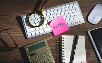 Sticker - Success text on sticky note with a business objects.