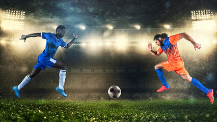 Two soccer players challenge each other chasing the ball at the stadium