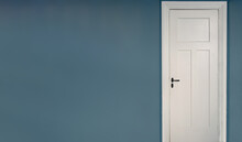 White Door Closed On Blue Wall Background. Interior Retro Black Metal Doorknob And Key Lock
