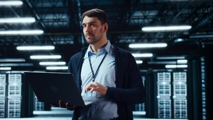 Fototapete - Successful Data Center IT Specialist Using Laptop Computer. Server Farm Cloud Computing Facility with System Administrator Working. Data Protection Engineering Network for Cyber Security.