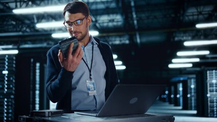 Fototapete - Successful Data Center IT Specialist Using Laptop Computer. Server Farm Cloud Computing Facility with System Administrator Working. Data Protection Engineering Network for Cyber Security.