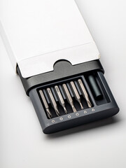 A set of screwdriver bits in a special box