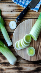 Wall Mural - Fresh and ripe leek lies on the table.